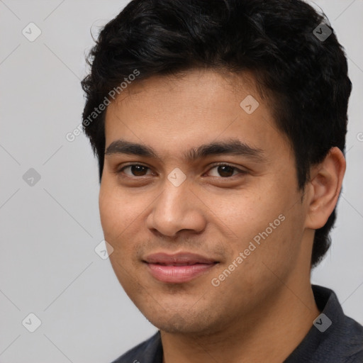 Joyful white young-adult male with short  black hair and brown eyes