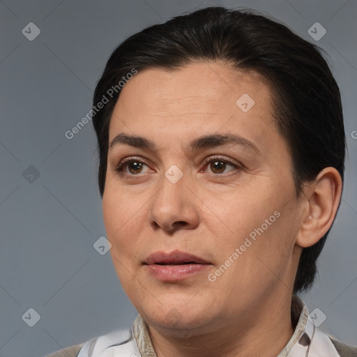 Joyful white adult female with medium  brown hair and brown eyes