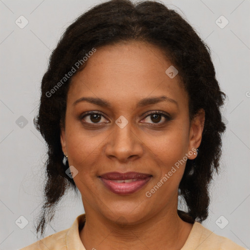 Joyful black adult female with medium  brown hair and brown eyes
