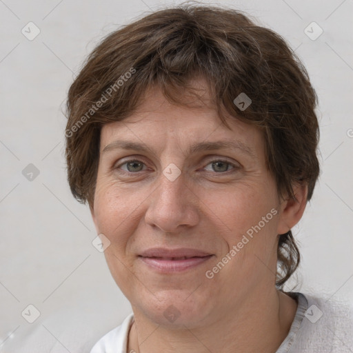 Joyful white adult female with short  brown hair and brown eyes