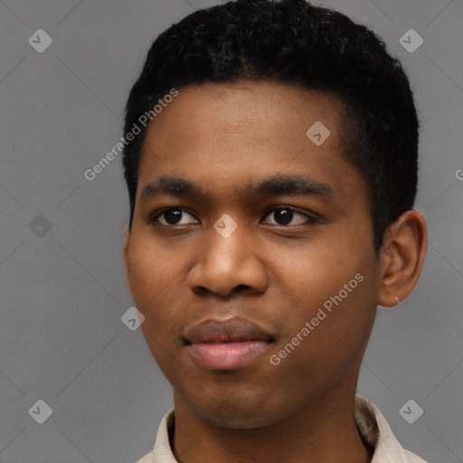 Joyful black young-adult male with short  black hair and brown eyes