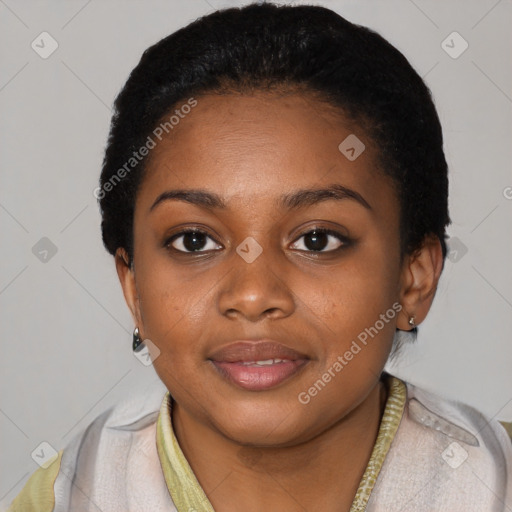 Joyful black young-adult female with short  black hair and brown eyes