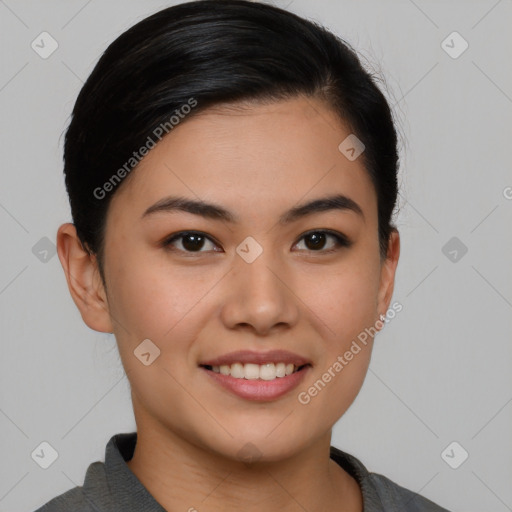 Joyful asian young-adult female with short  brown hair and brown eyes