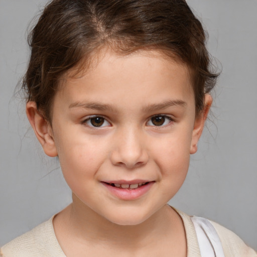 Joyful white child female with medium  brown hair and brown eyes