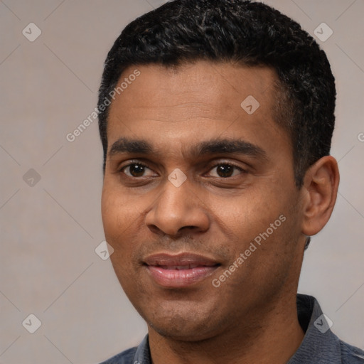 Joyful latino young-adult male with short  black hair and brown eyes