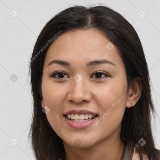 Joyful latino young-adult female with long  brown hair and brown eyes