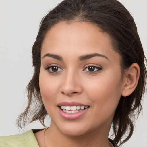 Joyful white young-adult female with medium  brown hair and brown eyes