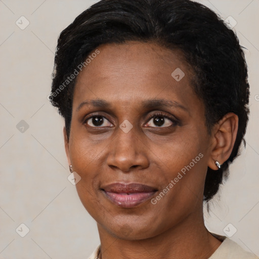 Joyful black adult female with short  brown hair and brown eyes