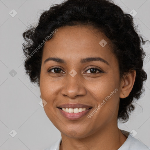 Joyful black young-adult female with medium  brown hair and brown eyes