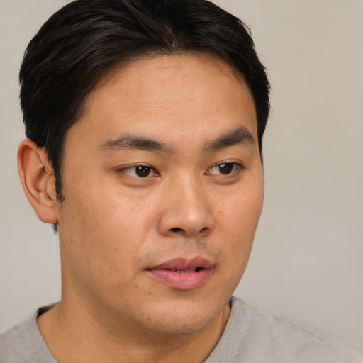 Neutral asian young-adult male with short  brown hair and brown eyes