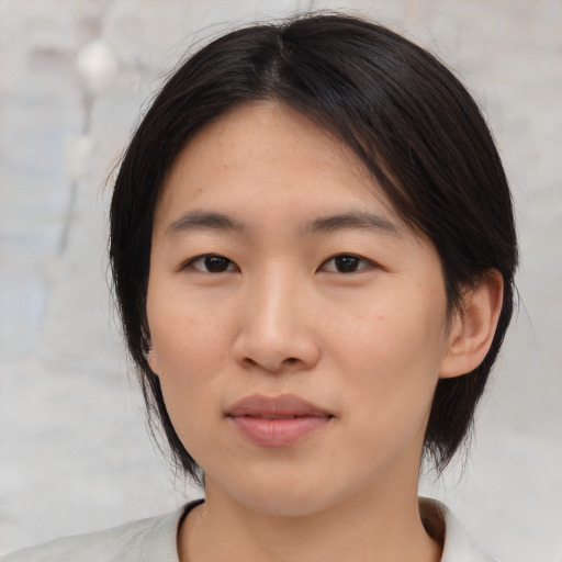 Neutral asian young-adult female with medium  brown hair and brown eyes