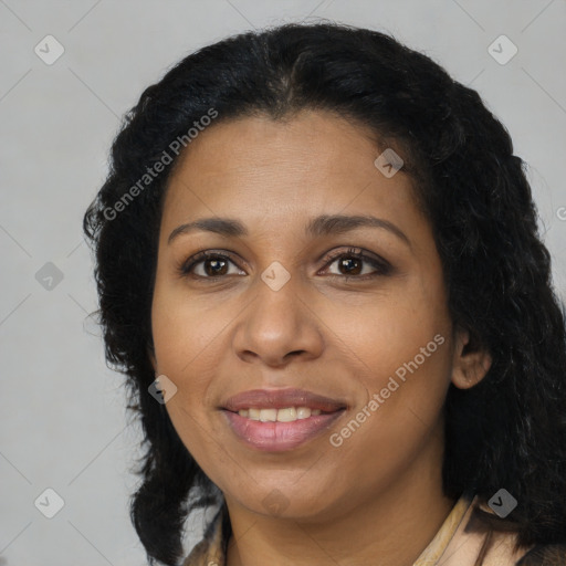 Joyful black adult female with medium  brown hair and brown eyes