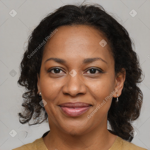 Joyful black adult female with medium  brown hair and brown eyes