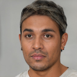 Neutral latino young-adult male with short  black hair and brown eyes