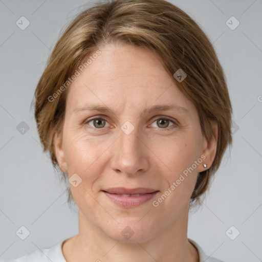 Joyful white adult female with medium  brown hair and grey eyes