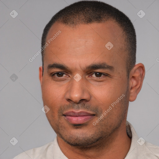 Joyful latino young-adult male with short  brown hair and brown eyes