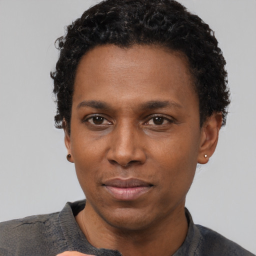 Neutral black adult male with short  black hair and brown eyes