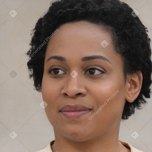 Joyful black young-adult female with medium  black hair and brown eyes