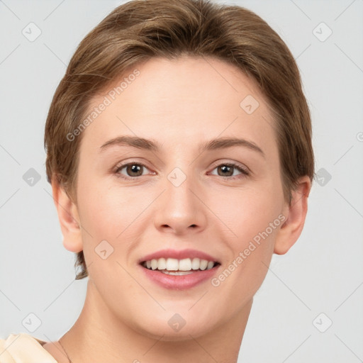 Joyful white young-adult female with short  brown hair and grey eyes