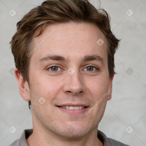 Joyful white adult male with short  brown hair and grey eyes