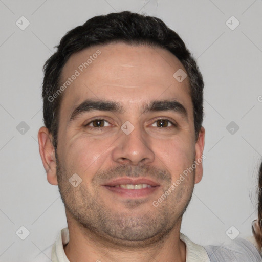 Joyful white adult male with short  brown hair and brown eyes