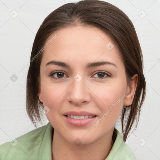 Joyful white young-adult female with medium  brown hair and brown eyes