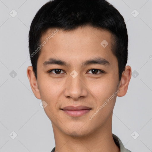 Joyful asian young-adult male with short  black hair and brown eyes