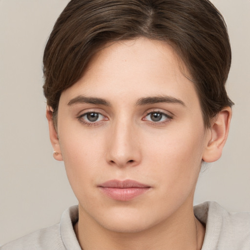 Neutral white young-adult female with short  brown hair and brown eyes