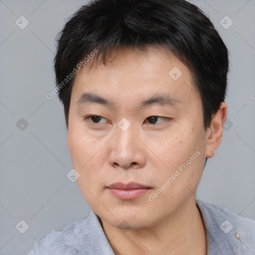 Neutral asian young-adult male with short  brown hair and brown eyes