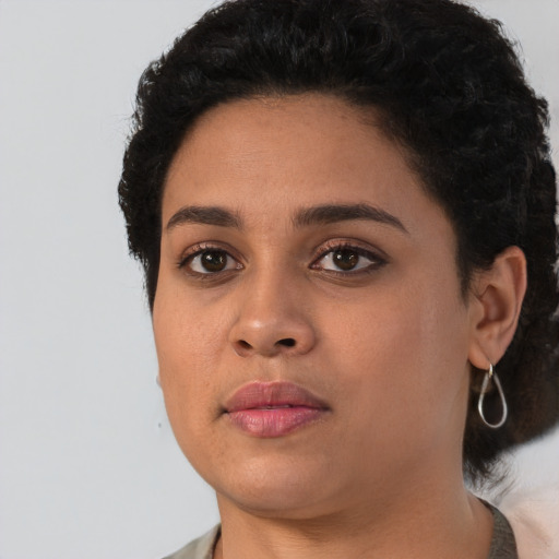 Neutral latino young-adult female with short  black hair and brown eyes