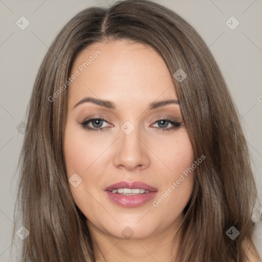 Joyful white young-adult female with long  brown hair and brown eyes