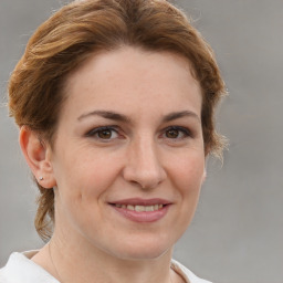 Joyful white adult female with short  brown hair and brown eyes