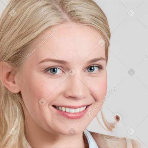 Joyful white young-adult female with long  brown hair and blue eyes