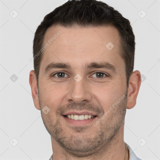 Joyful white young-adult male with short  brown hair and brown eyes