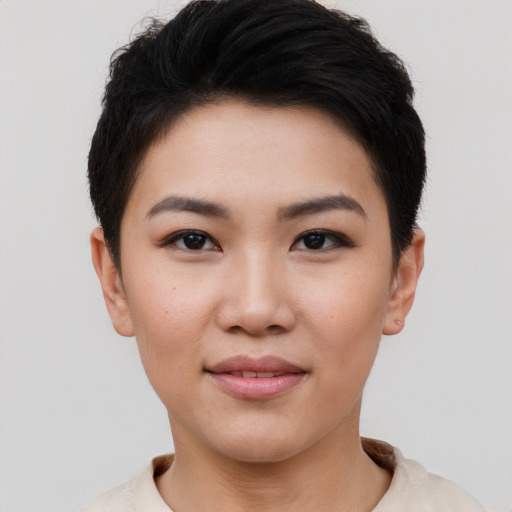 Joyful asian young-adult female with short  black hair and brown eyes