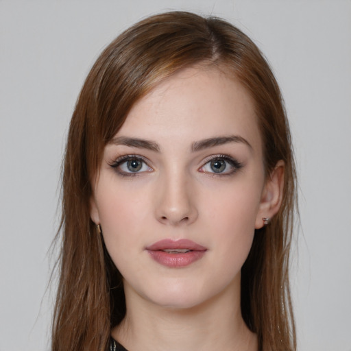 Neutral white young-adult female with long  brown hair and brown eyes