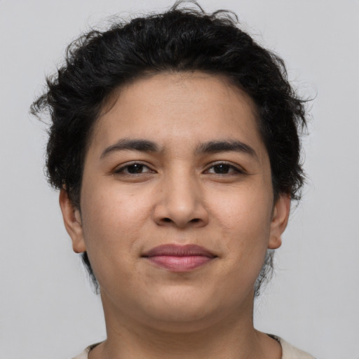 Joyful latino young-adult female with short  brown hair and brown eyes