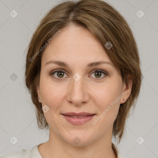 Joyful white young-adult female with medium  brown hair and green eyes