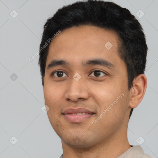 Joyful latino young-adult male with short  black hair and brown eyes