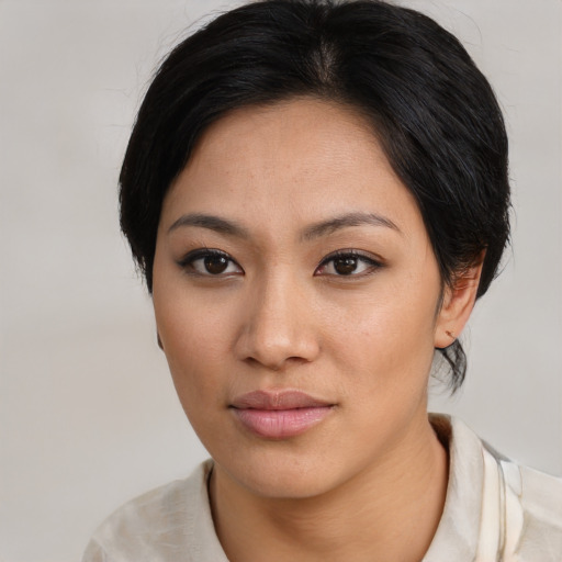 Neutral asian young-adult female with medium  black hair and brown eyes