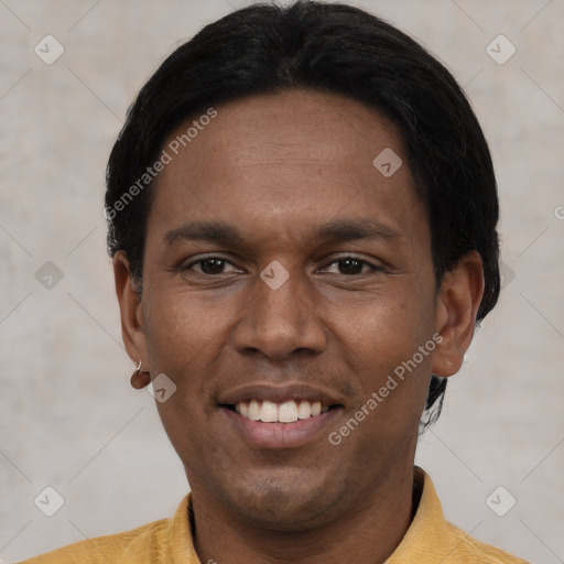 Joyful latino young-adult male with short  black hair and brown eyes