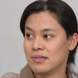 Joyful asian young-adult female with medium  brown hair and brown eyes