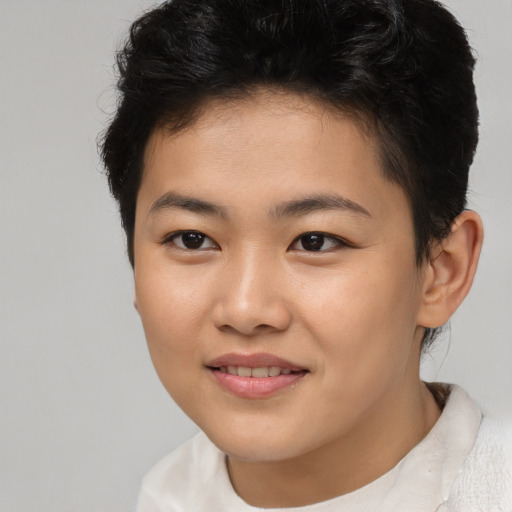 Joyful asian young-adult female with short  brown hair and brown eyes