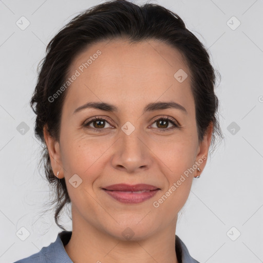 Joyful white adult female with medium  brown hair and brown eyes