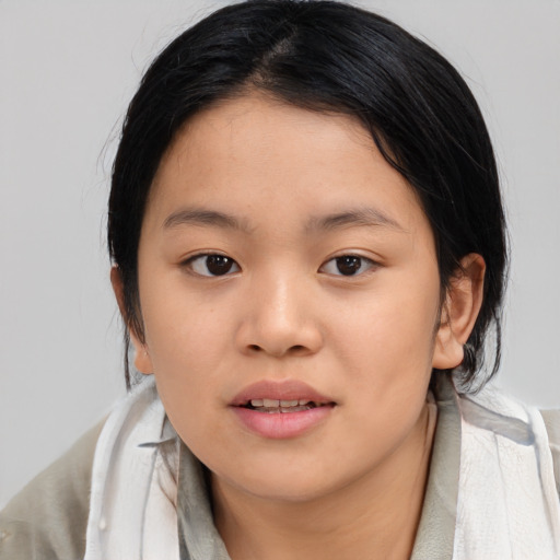 Joyful asian young-adult female with medium  black hair and brown eyes
