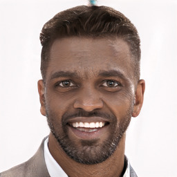 Joyful black young-adult male with short  brown hair and brown eyes