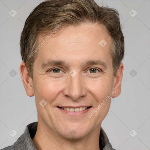 Joyful white adult male with short  brown hair and grey eyes