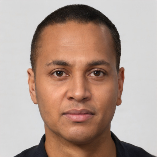 Neutral latino young-adult male with short  brown hair and brown eyes
