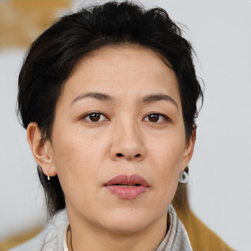Neutral asian young-adult female with medium  brown hair and brown eyes