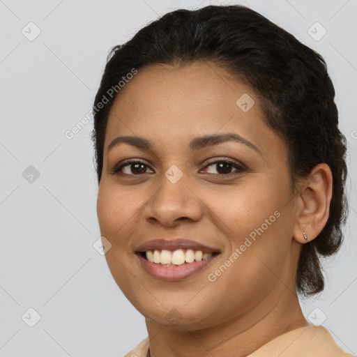 Joyful latino young-adult female with short  brown hair and brown eyes